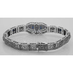 Detail view of Art Deco Style Blue Sapphire White Topaz Filigree Bracelet Sterling Silver highlighting White Topaz, Sapphire