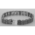 Back view of Victorian Style Blue Topaz and Diamond Filigree Link Bracelet showing 925 sterling silver hallmark and toggle or