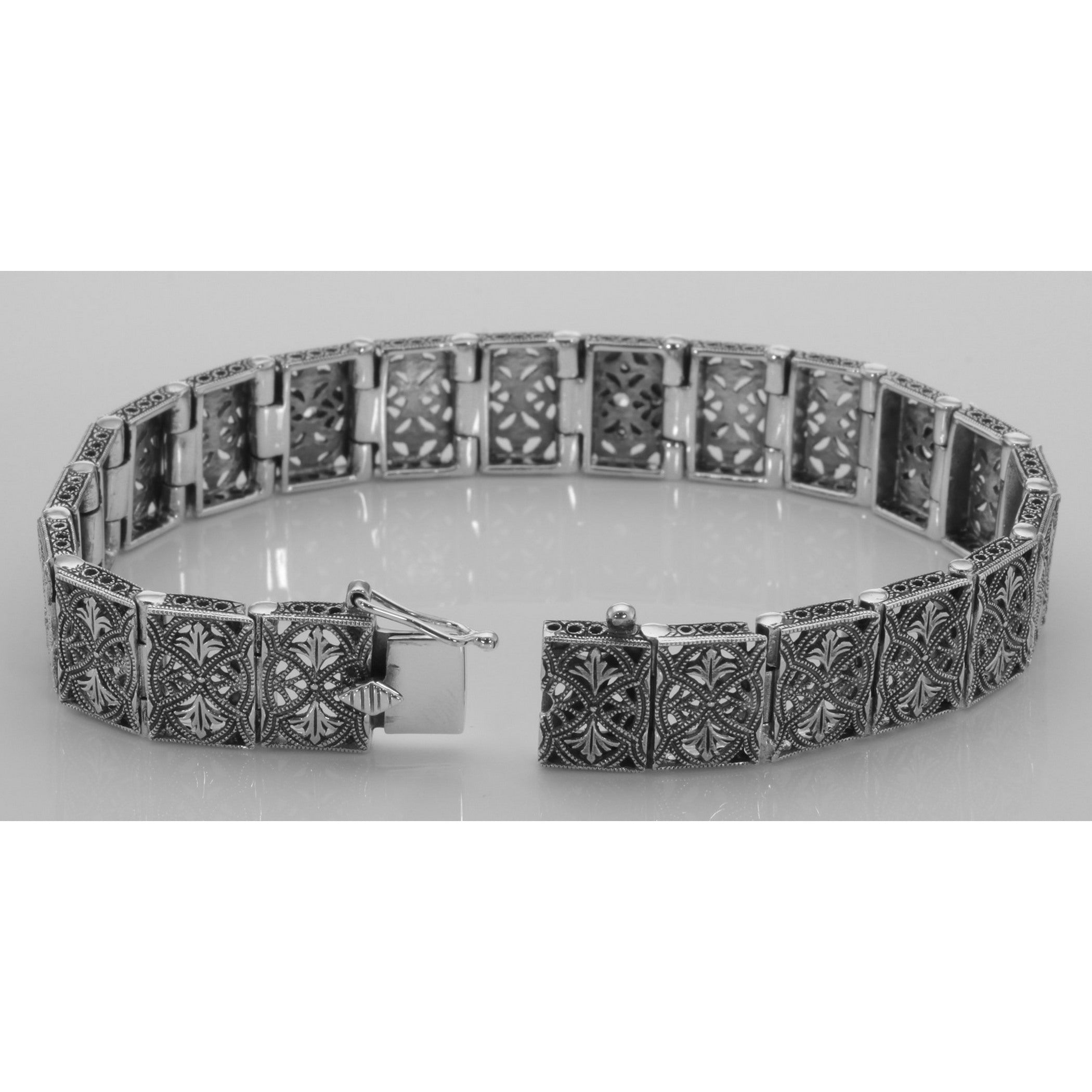 Back view of Victorian Style Blue Topaz and Diamond Filigree Link Bracelet showing 925 sterling silver hallmark and toggle or
