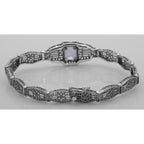 Detail view of Victorian Style Amethyst Filigree Link Bracelet in Fine Sterling Silver highlighting Amethyst