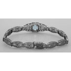 Detail view of Victorian Style Blue Topaz Filigree Link Bracelet in Fine Sterling Silver highlighting Blue Topaz