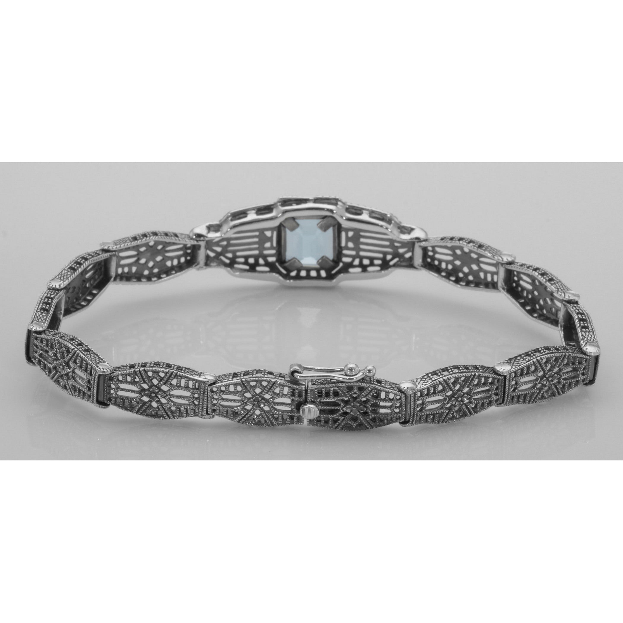 Detail view of Victorian Style Blue Topaz Filigree Link Bracelet in Fine Sterling Silver highlighting Blue Topaz