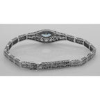 Detail view of Victorian Style Blue Topaz Filigree Link Bracelet in Fine Sterling Silver highlighting Blue Topaz
