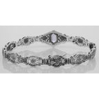Detail view of Victorian Style Amethyst Diamond Filigree Link Bracelet Sterling Silver highlighting Amethyst, Diamond