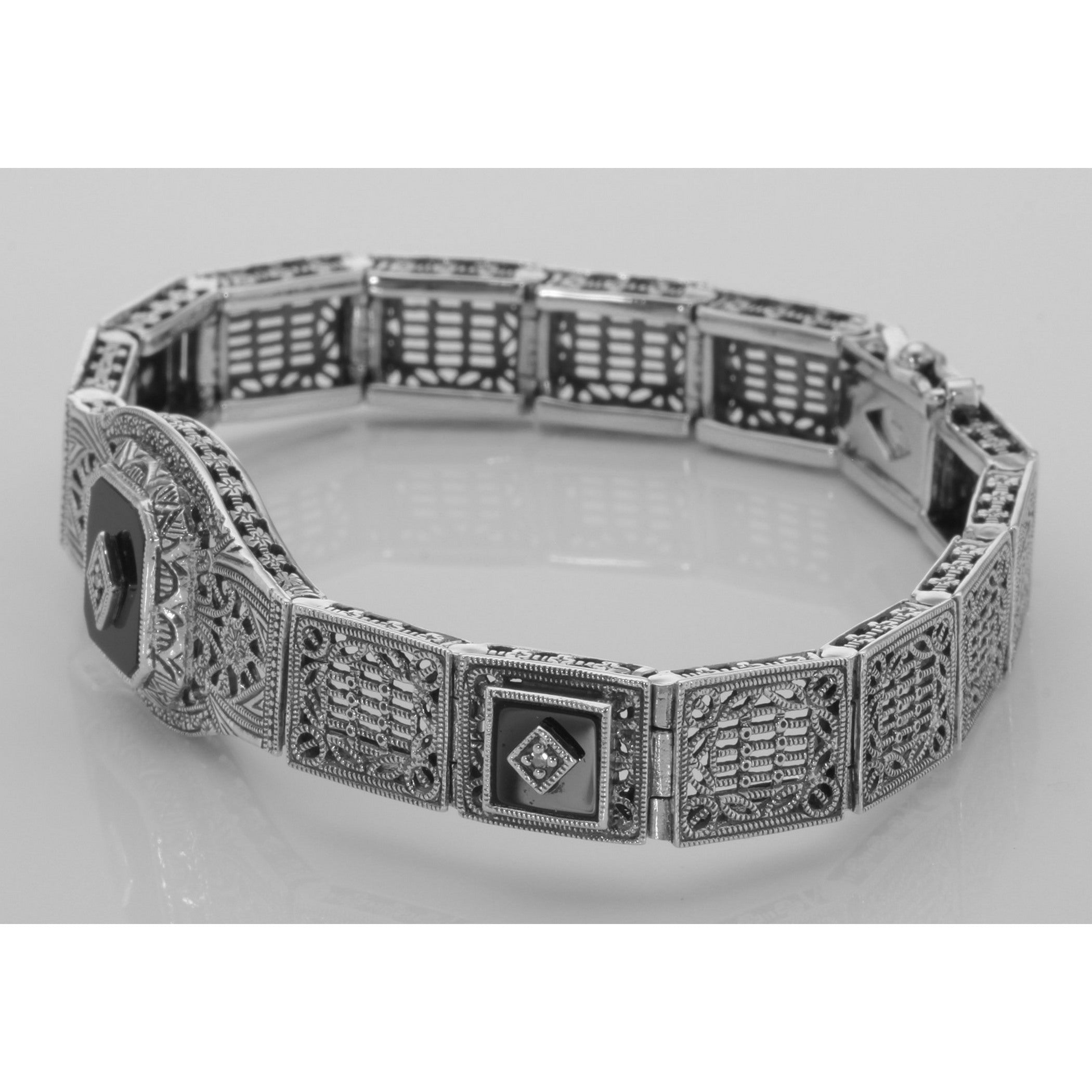 Detail view of Art Deco Style 3 Stone Black Onyx and Diamond Filigree Link Bracelet Sterling highlighting Diamond, Black Onyx