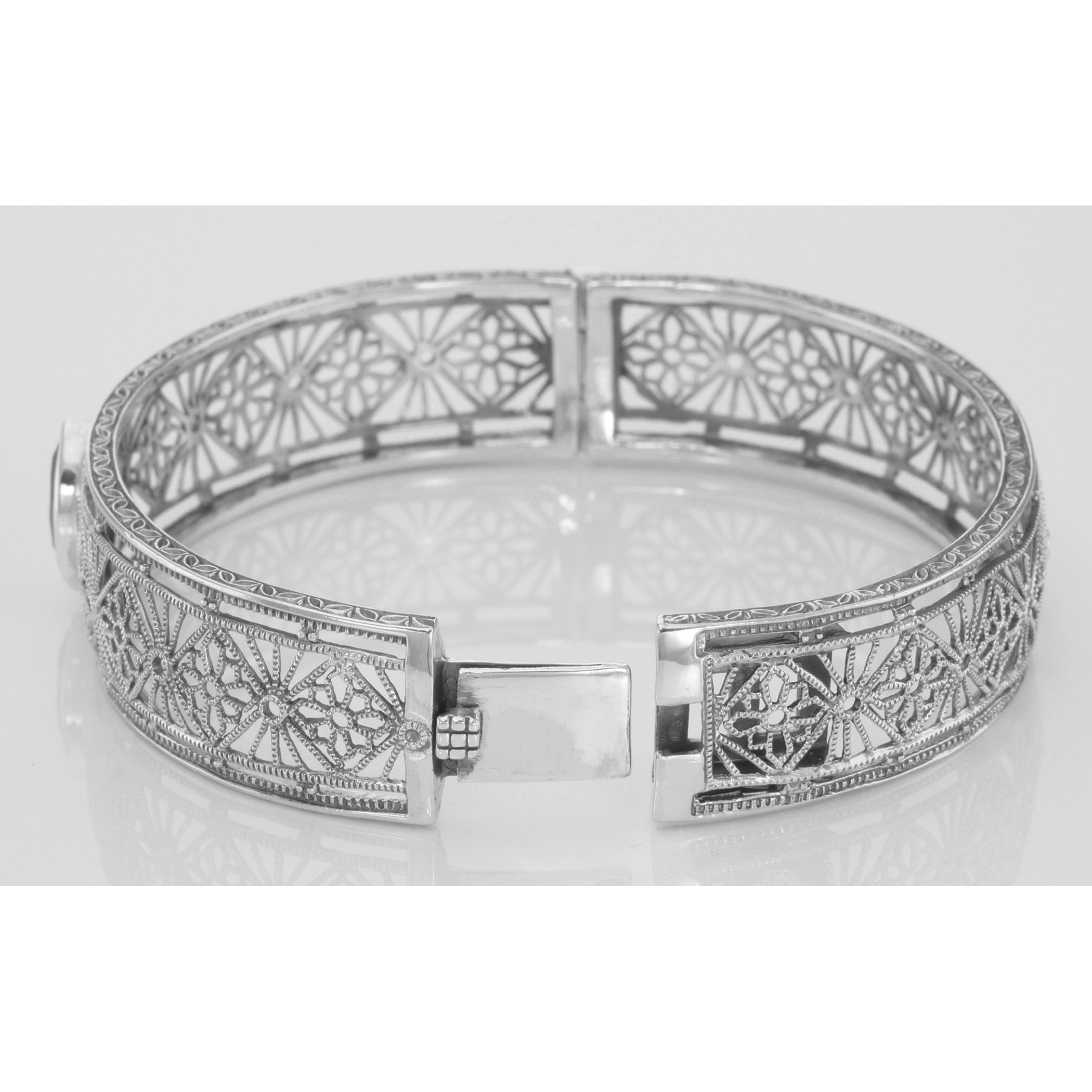 Back view of Victorian Style Filigree Garnet Bangle Bracelet In Fine Sterling Silver showing 925 sterling silver hallmark and