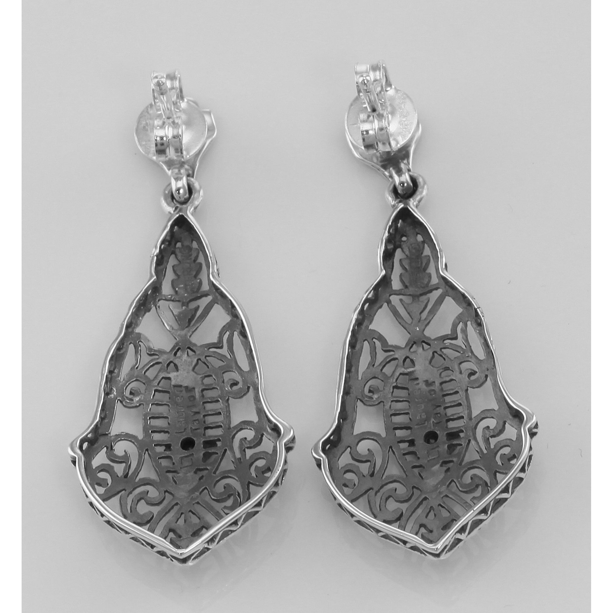 Back view of Sapphire Art Deco Style Filigree Drop Earrings showing 925 sterling silver hallmark and French wire hooks
