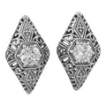 Art Deco diamond-shaped filigree stud earrings, round white topaz prong set, ornate scrollwork surround, sterling silver
