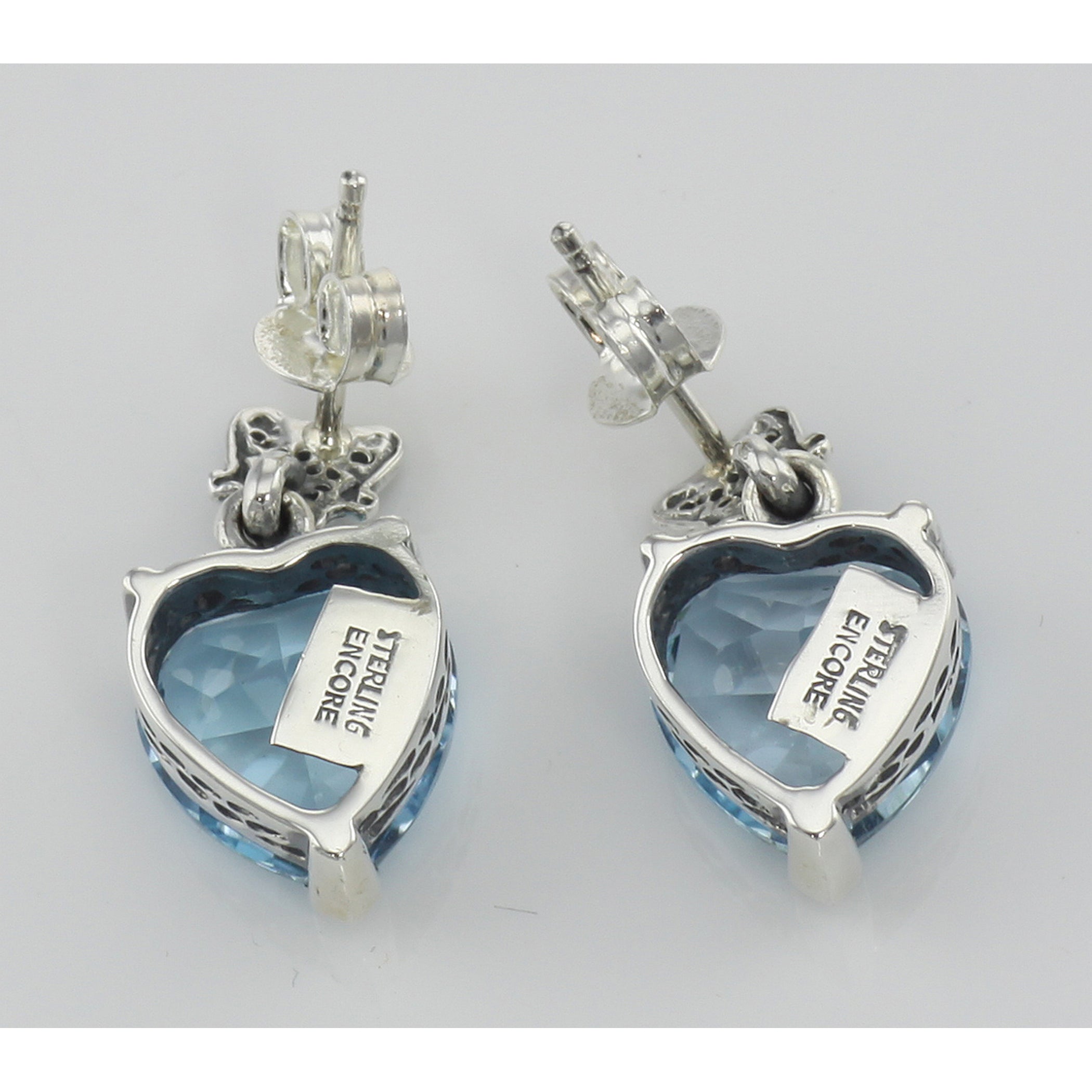 Back view of Beautiful Heart Shaped Blue Topaz Earrings showing 925 sterling silver hallmark and French wire hooks