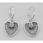 Back view of Antique Style Heart Shaped Filigree Earrings w/ Diamond showing 925 sterling silver hallmark and French wire hooks