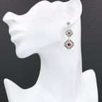 Detail view of Art Deco Style Garnet Two Tiered Earrings highlighting garnet detail