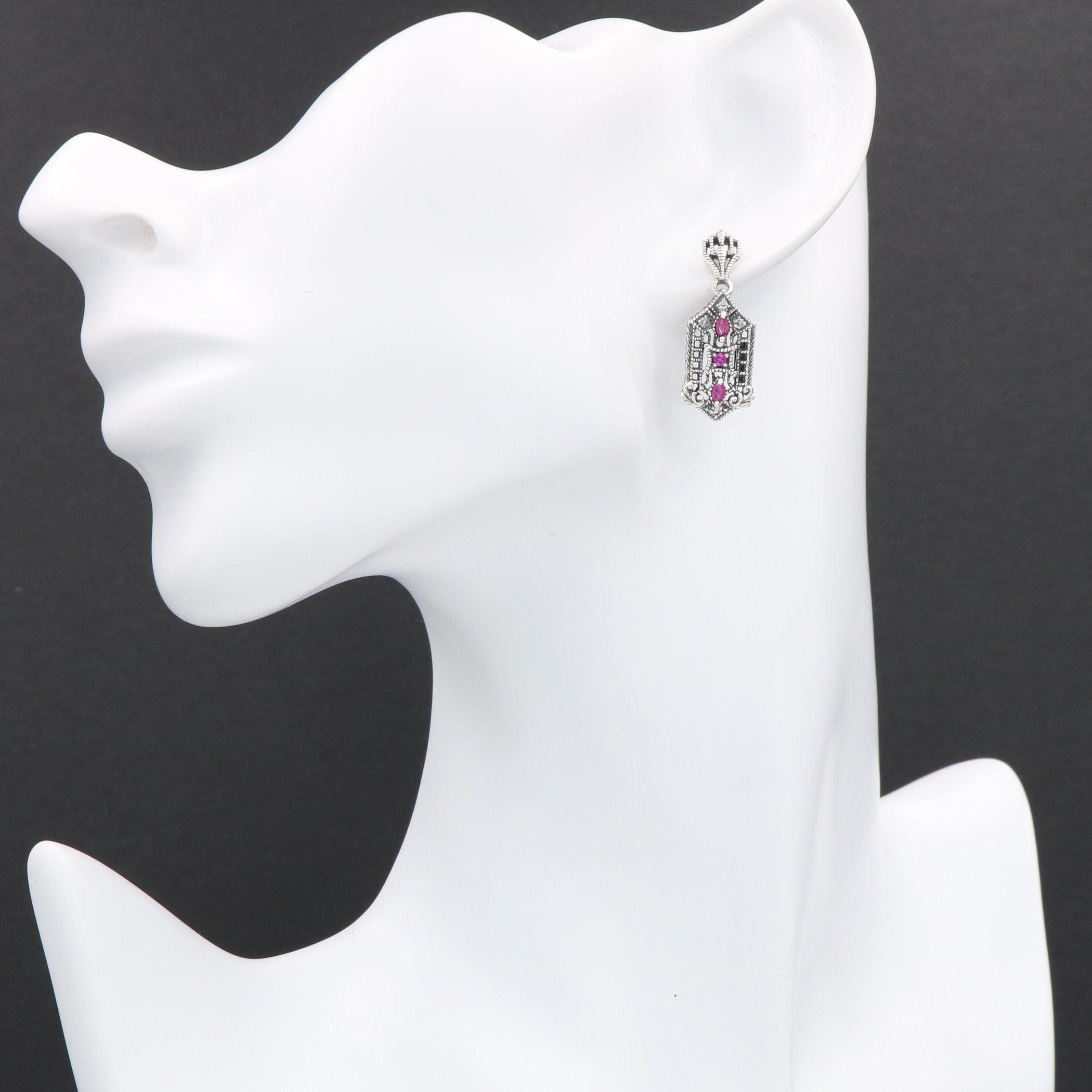 Detail view of Art Deco Genuine Ruby and White Topaz Filigree Earrings highlighting filigree detail