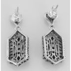 Back view of Art Deco Blue Sapphire and White Topaz Filigree Earrings showing 925 sterling silver hallmark and French wire hooks