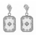 Art Deco sunray camphor glass earrings, carved starburst glass, diamond center, filigree border, sterling silver, leaf post