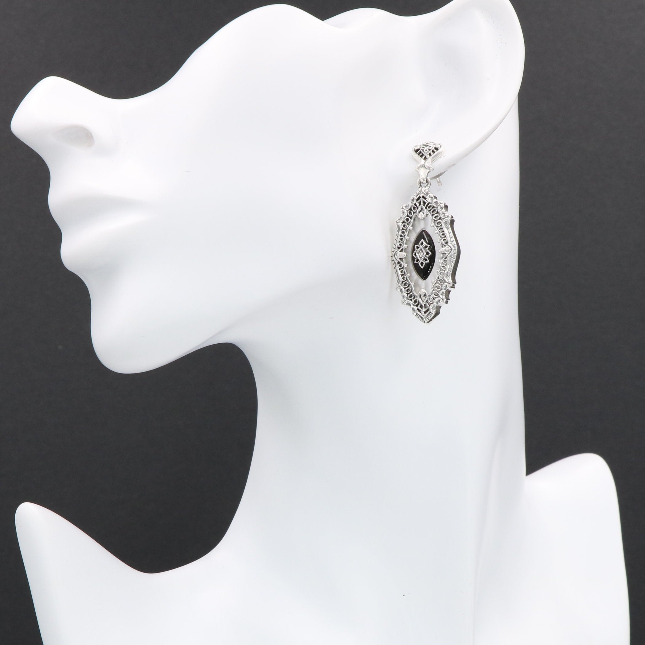 Detail view of Sunray Camphor Glass and Jet Genuine Diamond Filigree Earrings highlighting filigree detail