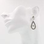 Detail view of Sunray Crystal and Marcasite Filigree Earrings highlighting filigree detail