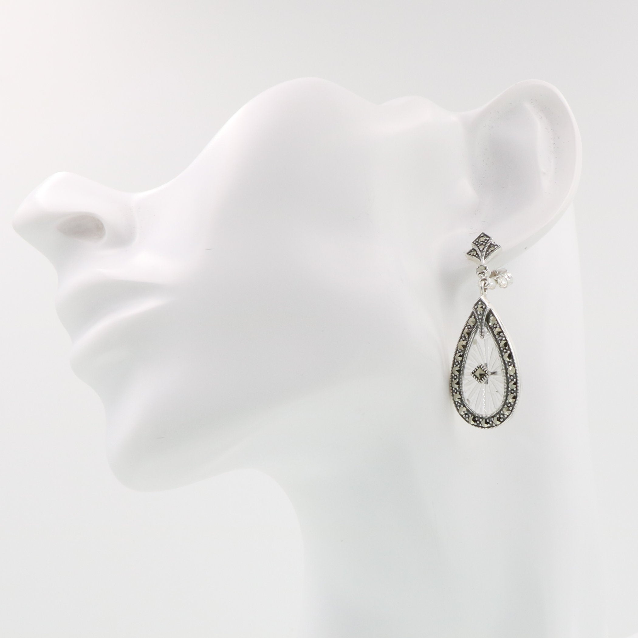 Detail view of Sunray Crystal and Marcasite Filigree Earrings highlighting filigree detail