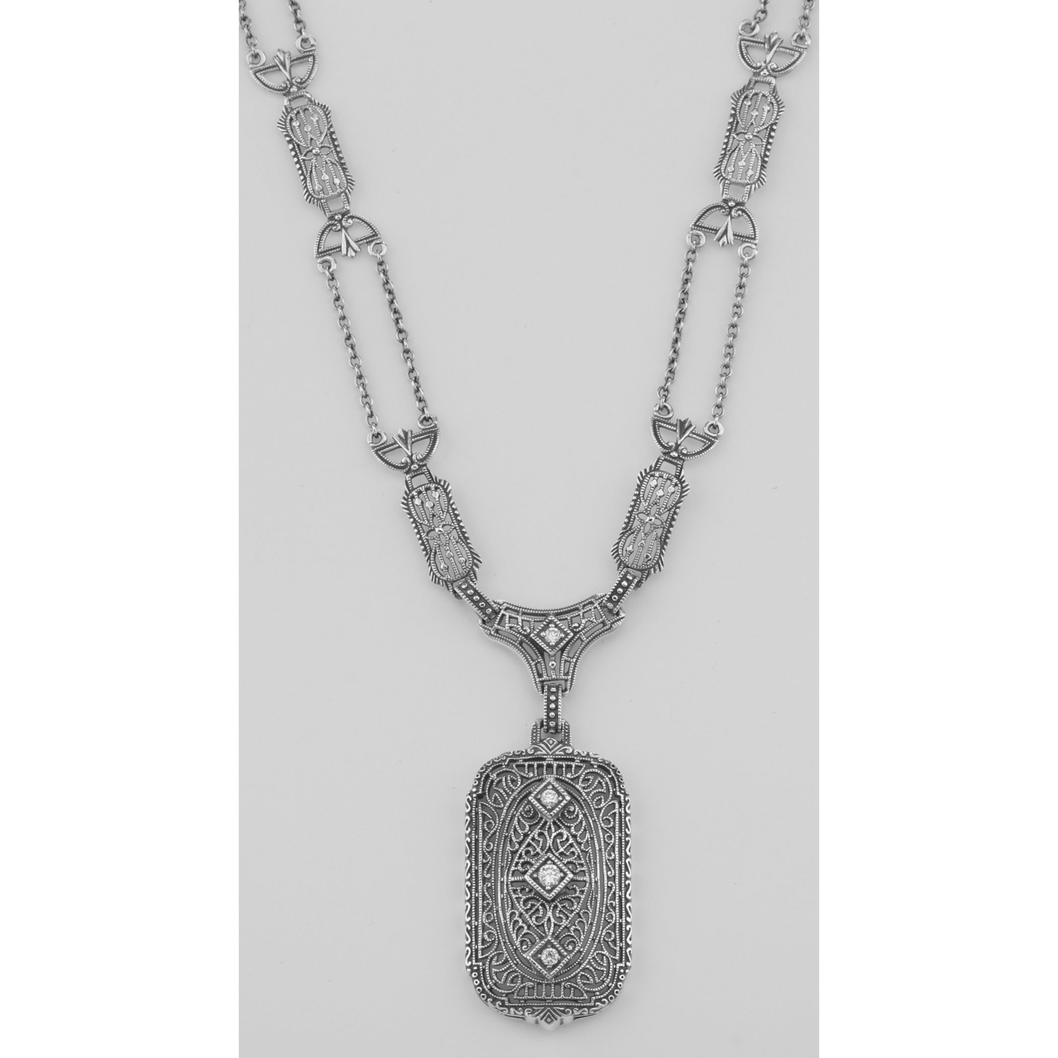 Detail view of Victorian Style White Topaz Filigree Necklace with 18 Inch Chain Sterling Silver highlighting White Topaz
