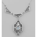 Back view of Unique Victorian Style Blue Topaz Filigree Necklace showing 925 sterling silver hallmark and spring ring clasp