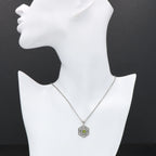 Detail view of Art Deco Hexagon Filigree Green Peridot Pendant Adjustable Chain Sterling Silver highlighting Peridot