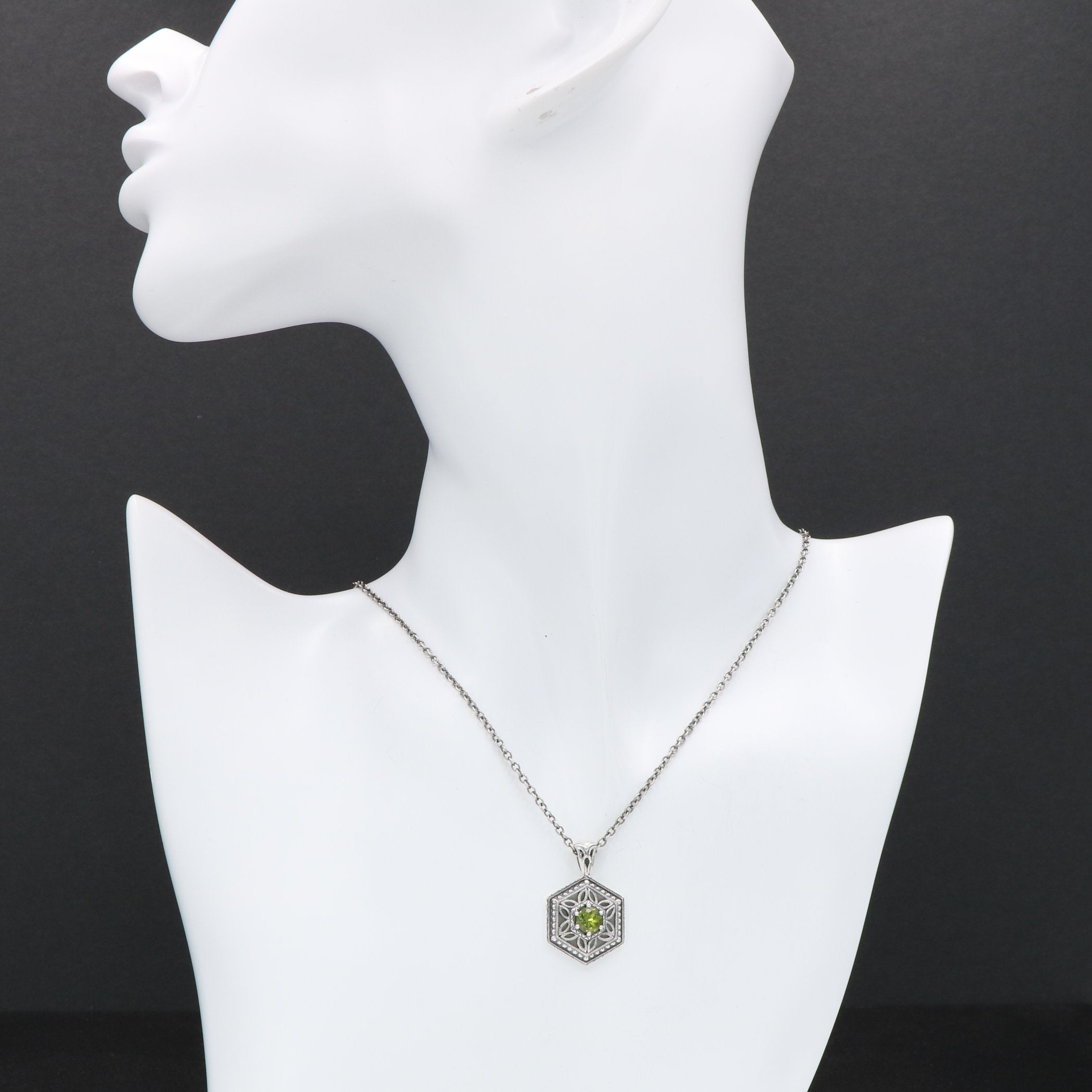 Detail view of Art Deco Hexagon Filigree Green Peridot Pendant Adjustable Chain Sterling Silver highlighting Peridot