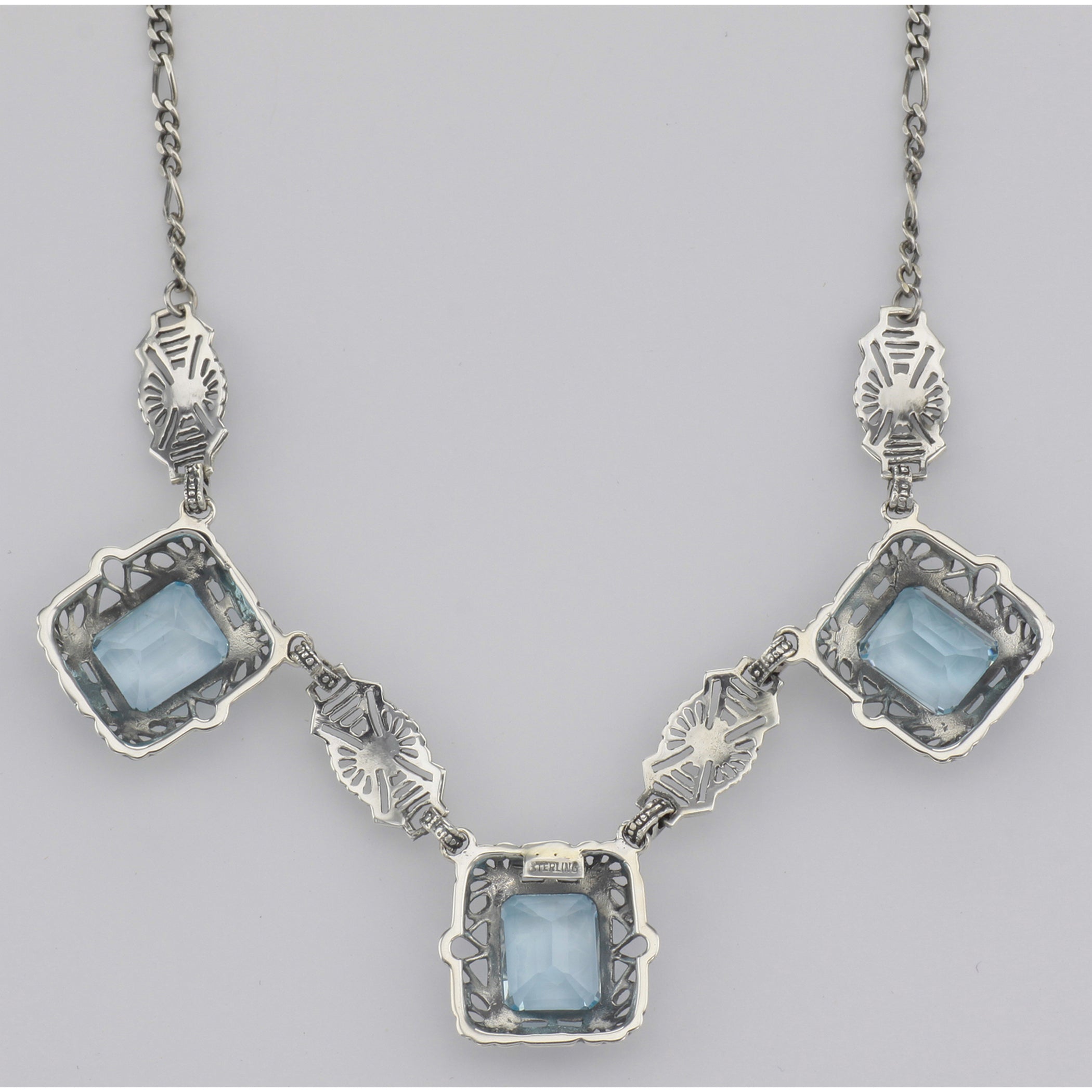 Back view of Art Deco Style 3 Gemstone Blue Topaz Filigree 17.5 Inch Necklace Sterling Silver showing 925 sterling silver hal