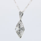 Detail view of Victorian Style White Topaz Filigree Pendant with Chain highlighting White Topaz