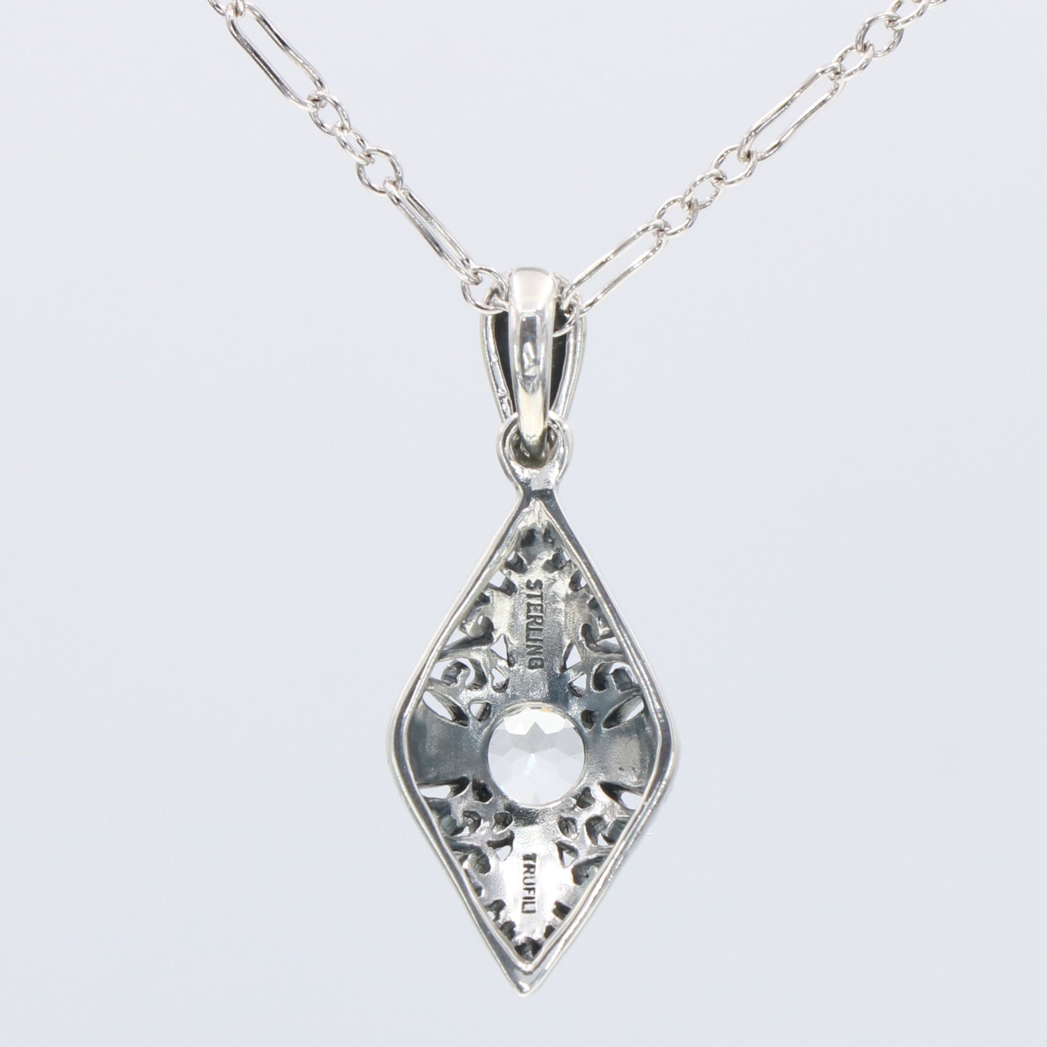 Back view of Victorian Style White Topaz Filigree Pendant with Chain showing 925 sterling silver hallmark and spring ring cla