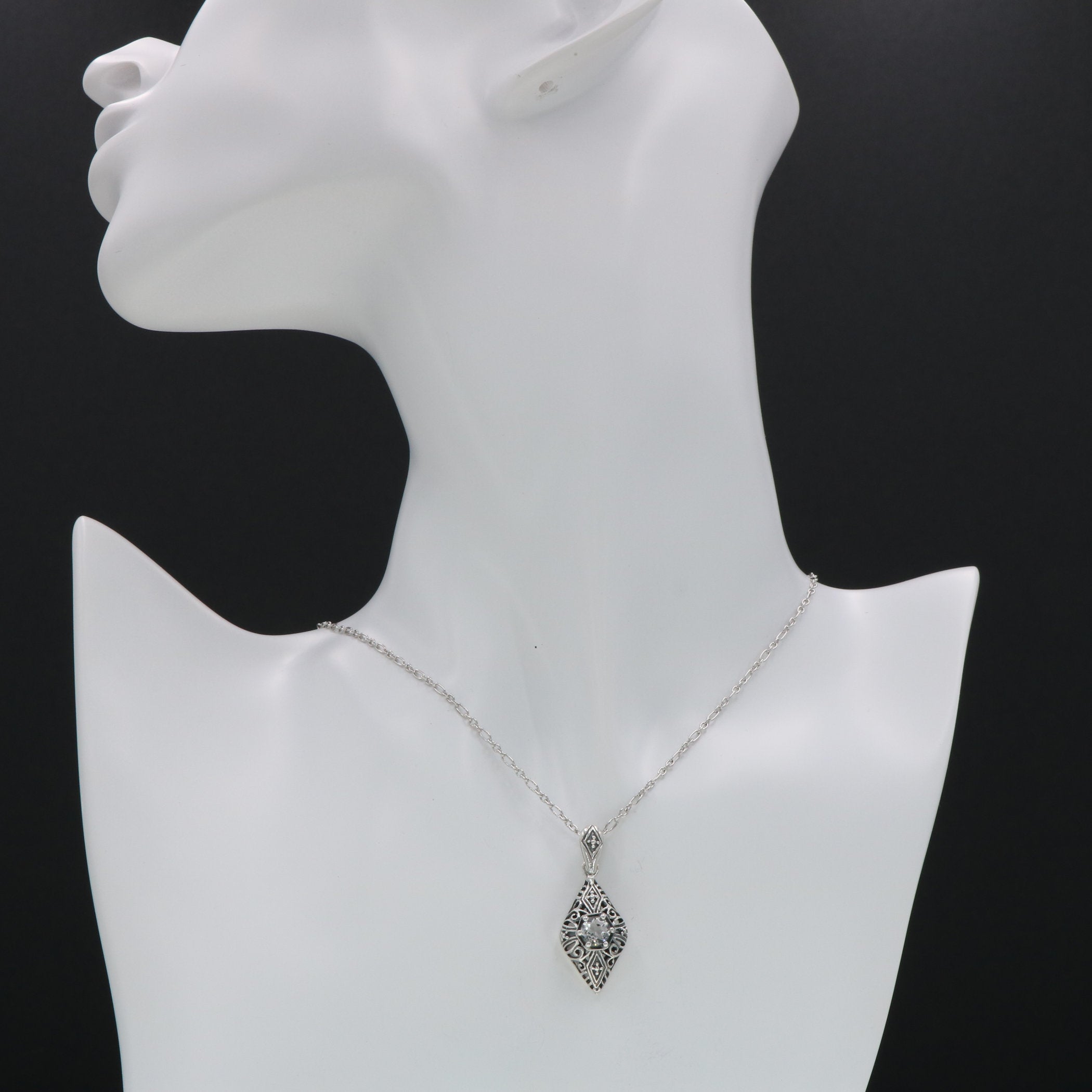Detail view of Victorian Style White Topaz Filigree Pendant with Chain highlighting White Topaz