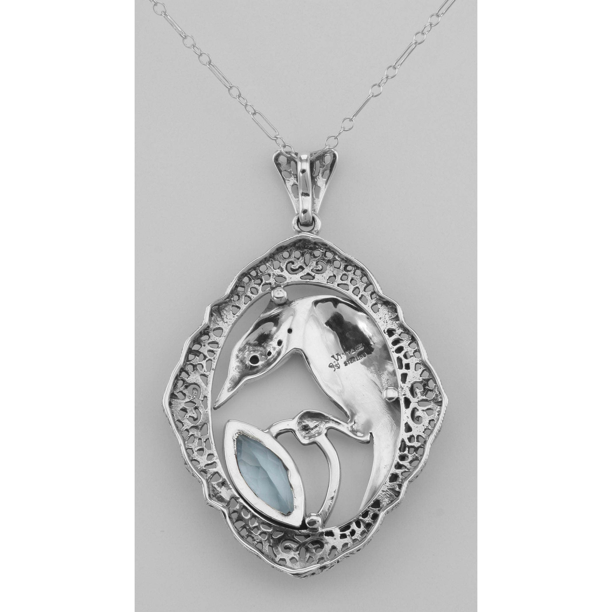 Back view of Filigree Enamel Bird Pendant w/ 3 Carat Blue Topaz showing 925 sterling silver hallmark and spring ring clasp