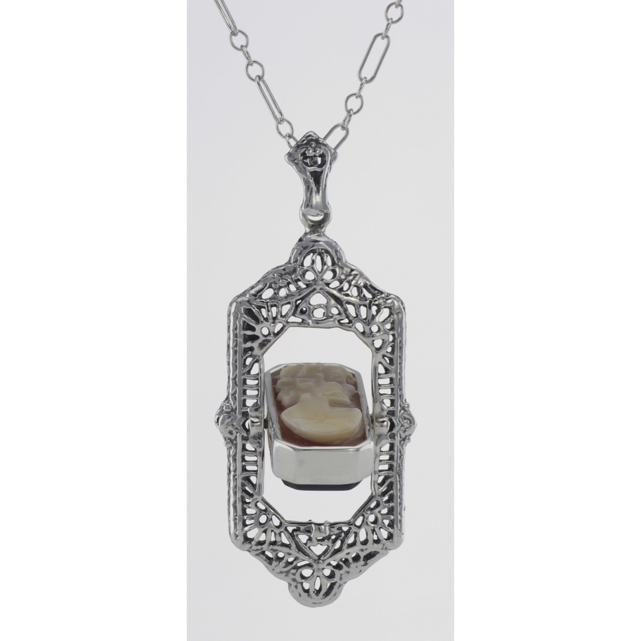 Detail view of Italian Shell Cameo / Onyx Filigree Flip Pendant highlighting Onyx