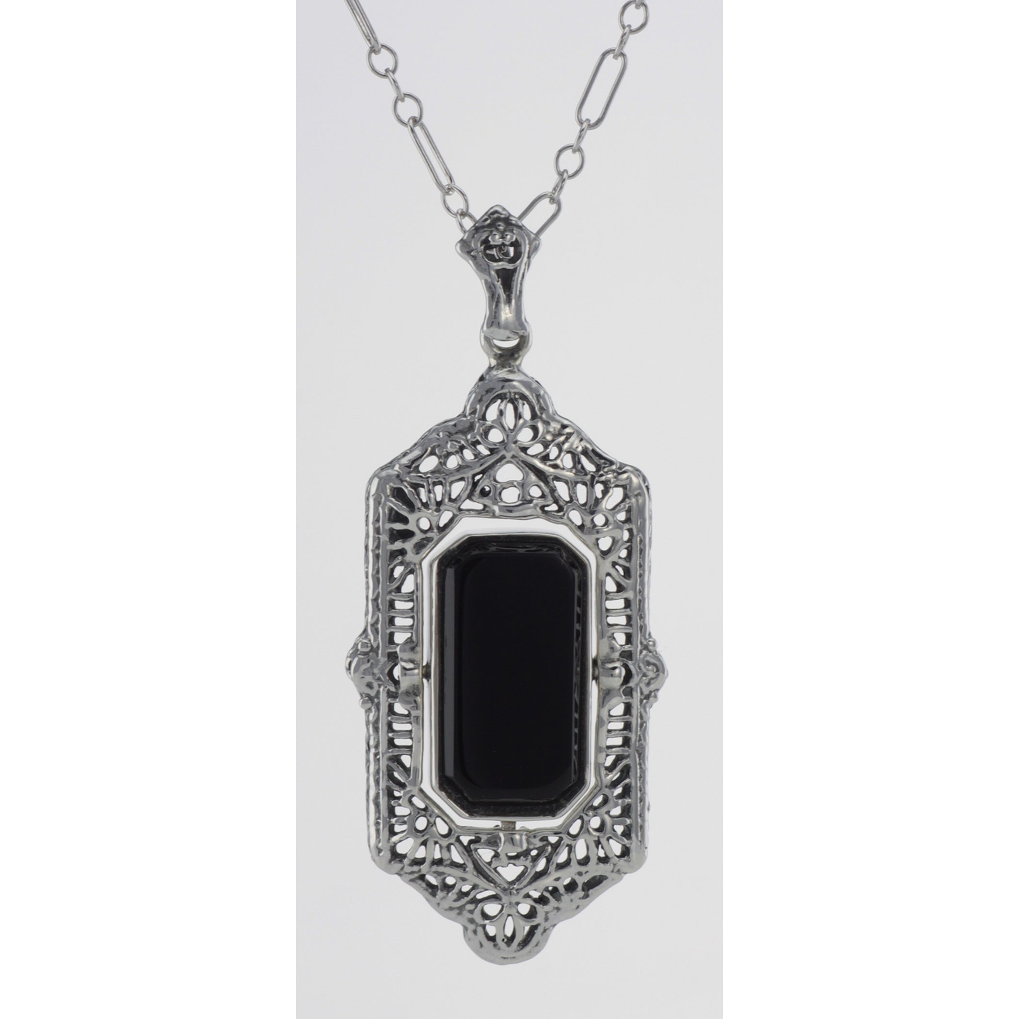 Detail view of Italian Shell Cameo / Onyx Filigree Flip Pendant highlighting Onyx