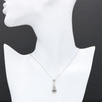Detail view of Sapphire and White Topaz Filigree Pendant highlighting White Topaz, Sapphire