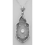 Back view of Sunray Camphor Glass Filigree Pendant w/ Diamond showing 925 sterling silver hallmark and spring ring clasp
