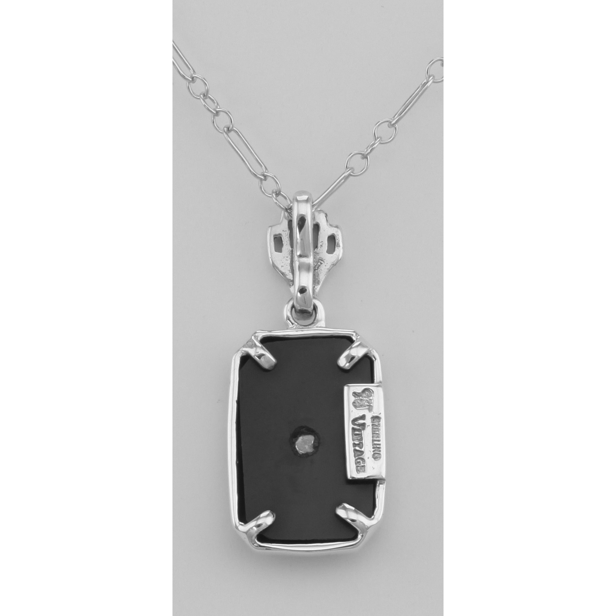 Back view of Genuine Black Onyx Filigree Pendant w/ Diamond showing 925 sterling silver hallmark and spring ring clasp