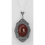 Back view of Art Deco Style Faceted Carnelian Filigree Pendant showing 925 sterling silver hallmark and spring ring clasp
