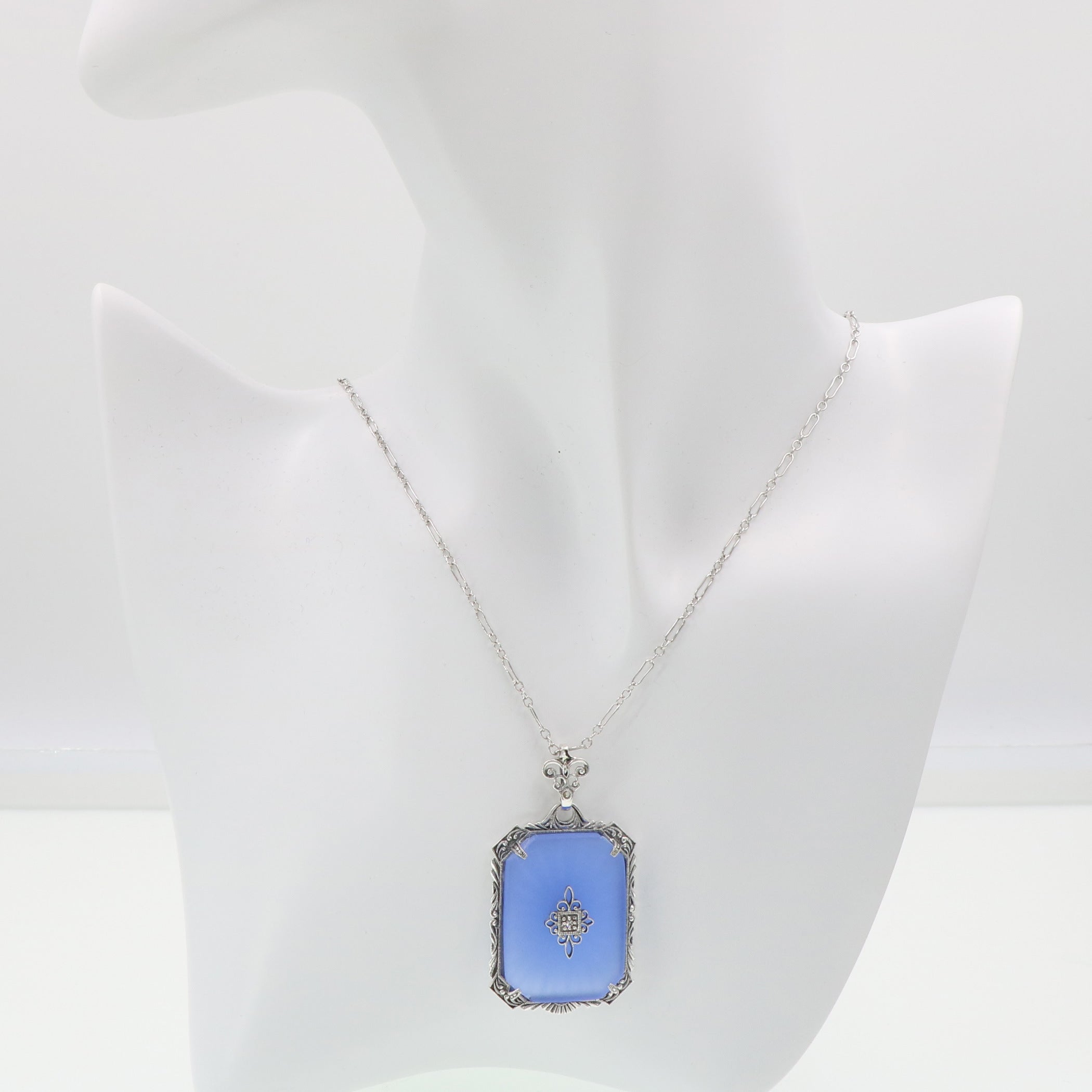Detail view of Filigree Pendant w/ blue pressed glass crystal with diamond Sterling Silver highlighting Diamond, Crystal