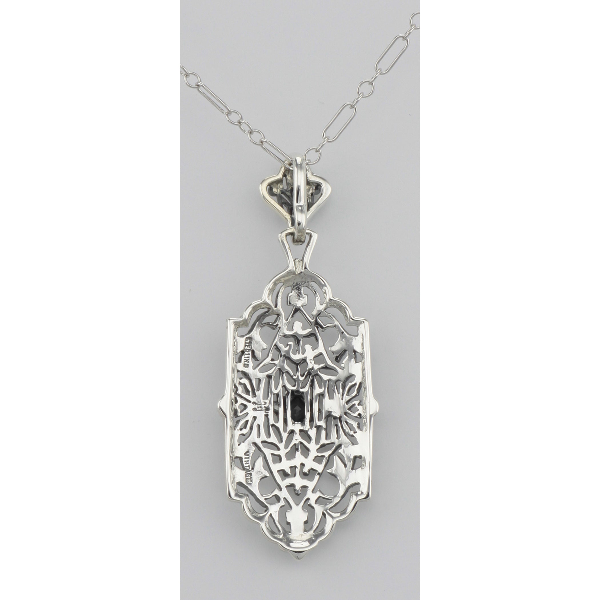Back view of Art Deco Style Filigree Pendant w/ Blue Sapphire showing 925 sterling silver hallmark and spring ring clasp