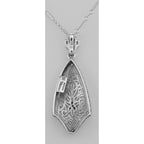 Back view of Art Deco Style Filigree Pendant w/ Blue Sapphire showing 925 sterling silver hallmark and spring ring clasp