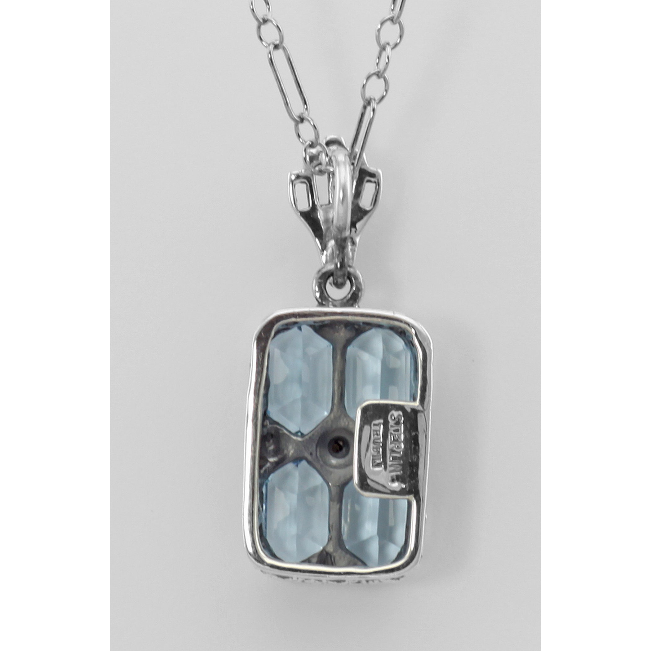 Back view of Art Deco Blue Topaz Filigree Diamond Pendant 18 Chain Sterling Silver showing 925 sterling silver hallmark and s