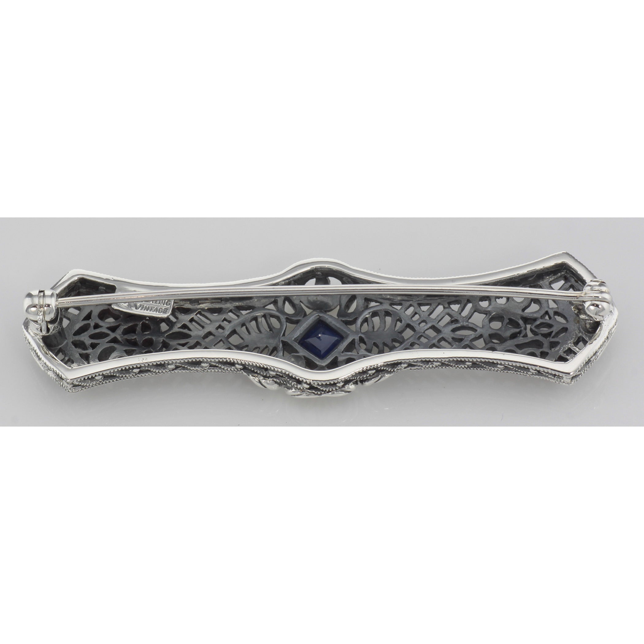 Back view of Art Deco Style Blue Sapphire Filigree Bar Pin / Brooch showing 925 sterling silver hallmark and pin back