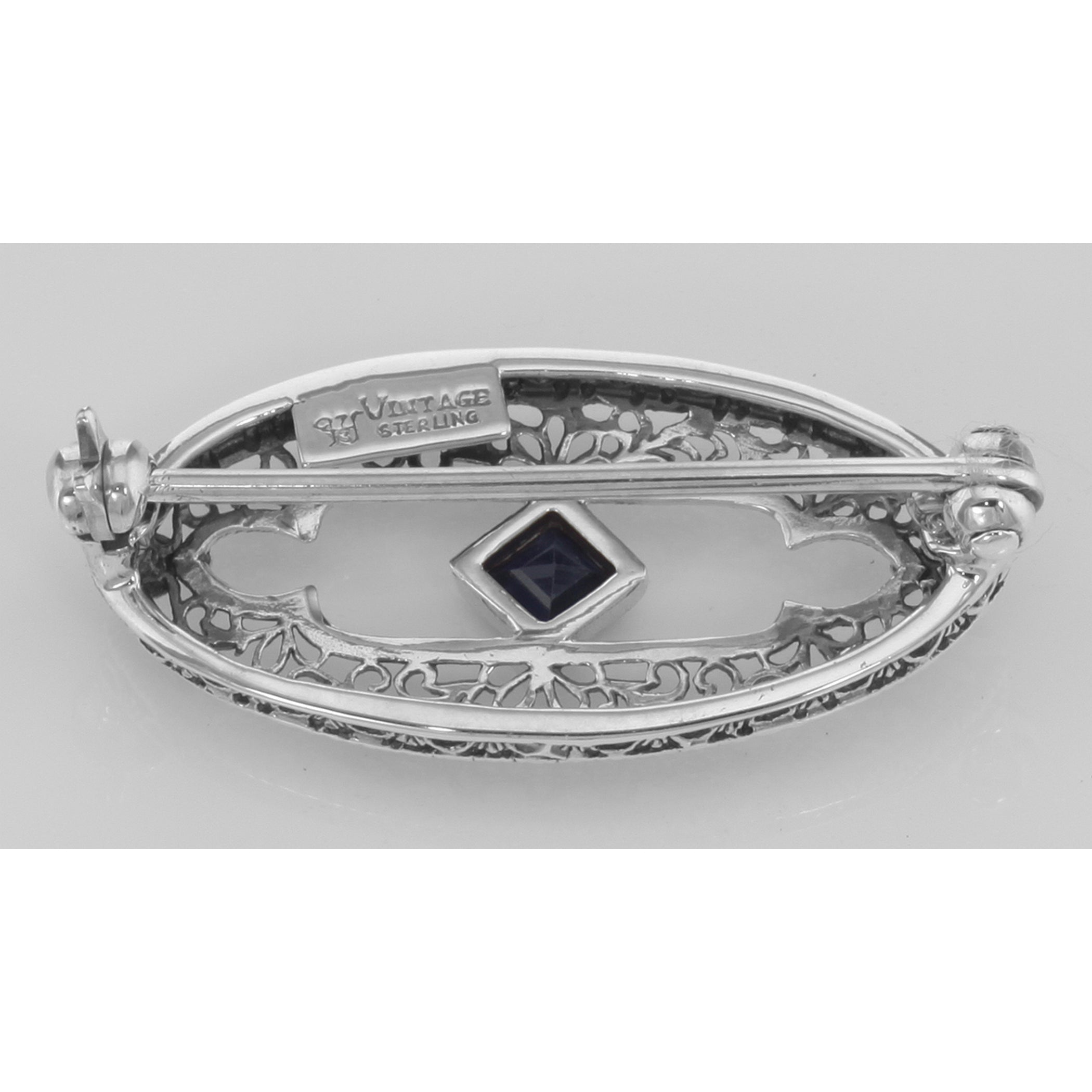 Back view of Antique Style Filigree Blue Sapphire Pin / Brooch showing 925 sterling silver hallmark and pin back