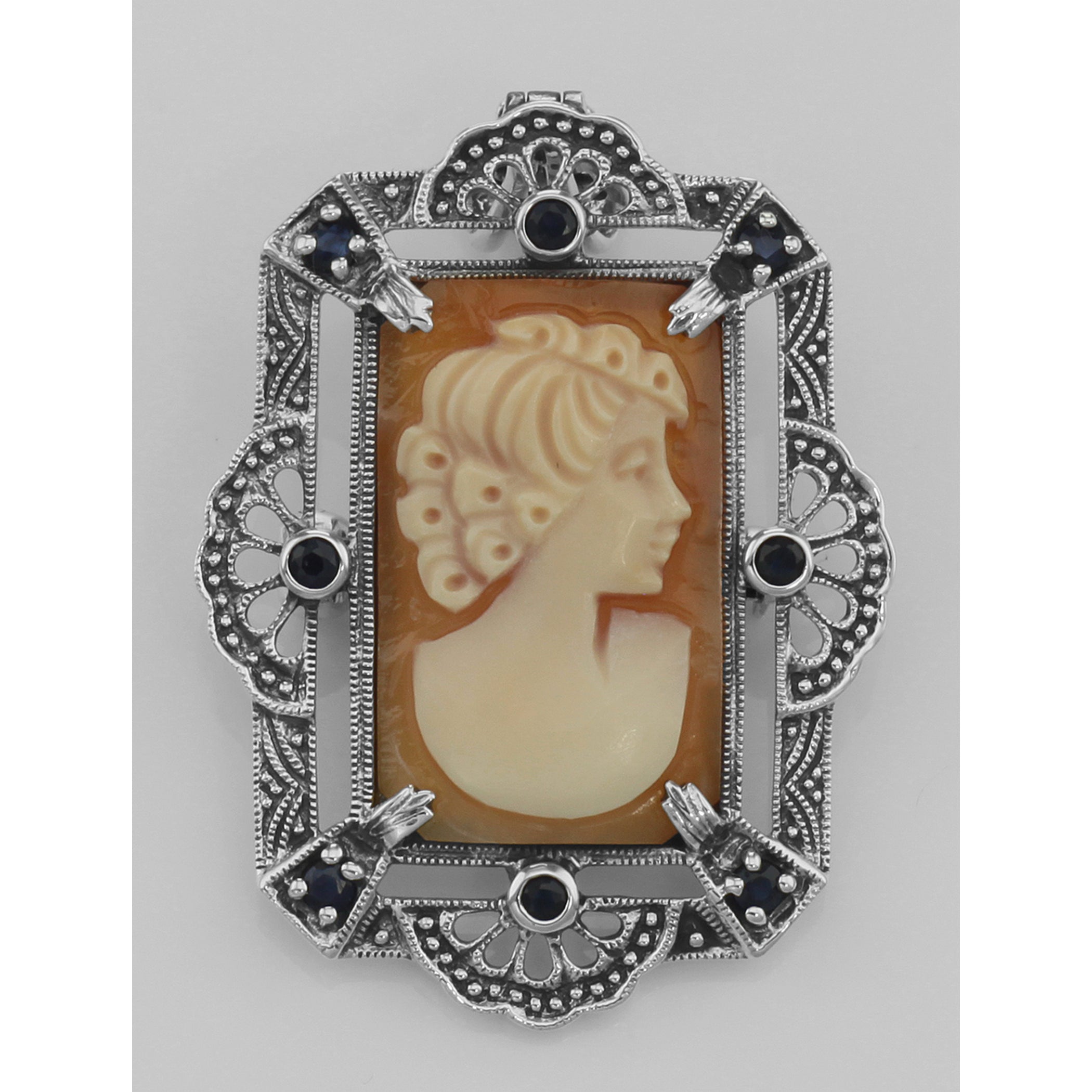 Detail view of Lovely Italian Shell Cameo Pin or Pendant with Blue Sapphires highlighting Sapphire