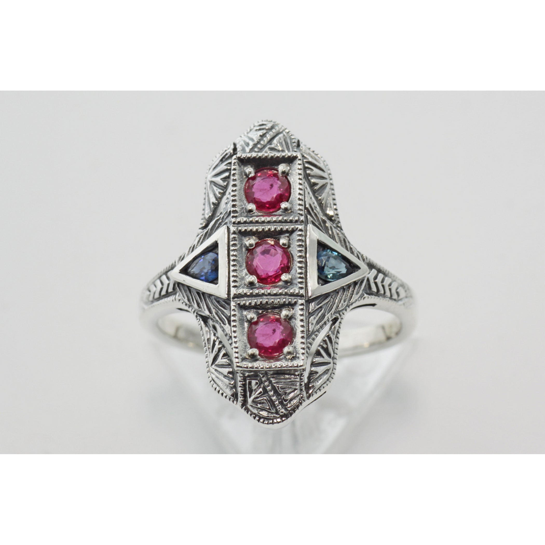 Detail view of Art Deco Style 3 Stone Natural Red Ruby and Sapphire Ring Sterling Silver highlighting Ruby, Sapphire