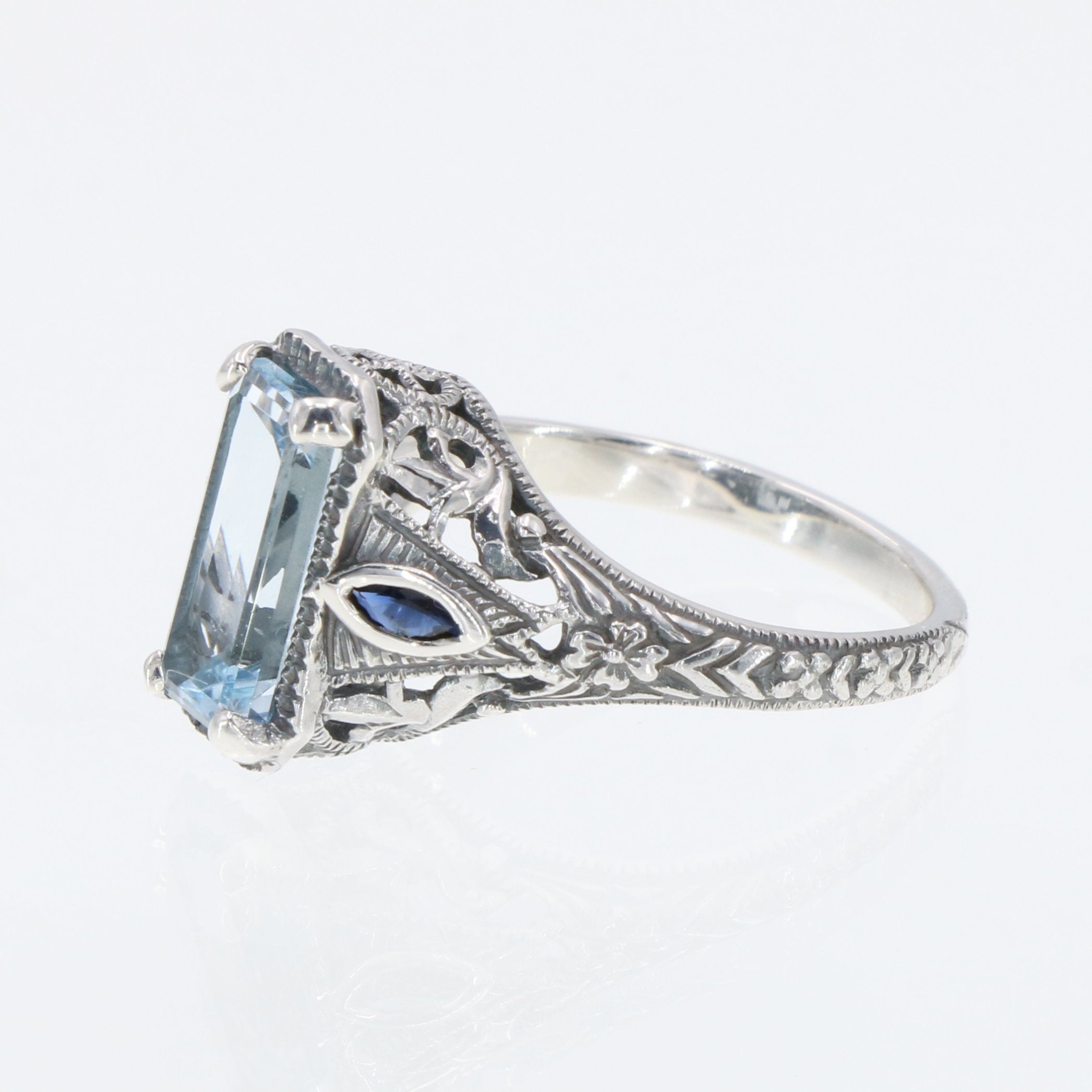 Detail view of Art Deco Style Blue Topaz Filigree Ring Sapphire Accents Sterling Silver highlighting Blue Topaz, Sapphire