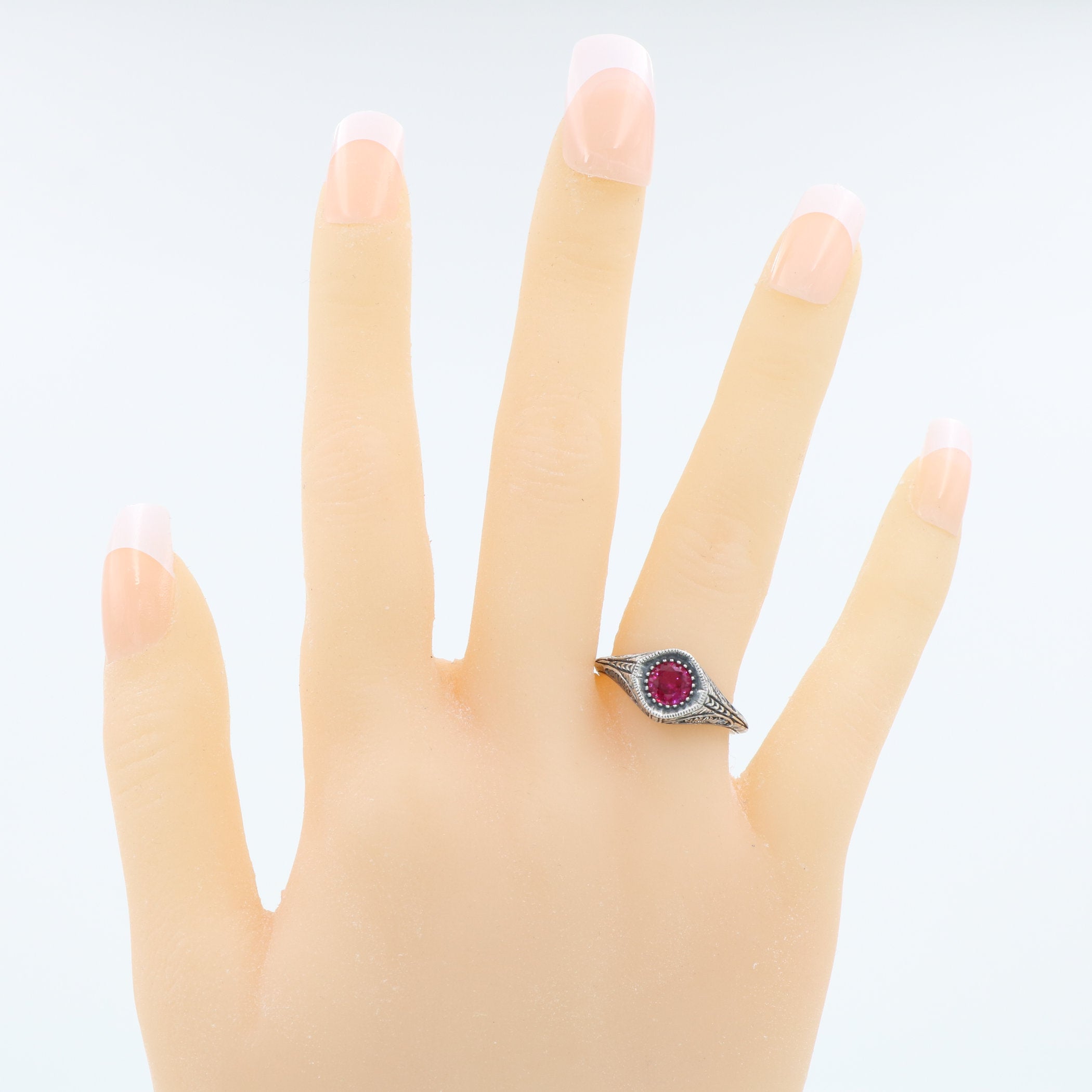 Detail view of Art Deco Style Sterling Silver Red Pink Ruby Filigree Ring highlighting Ruby