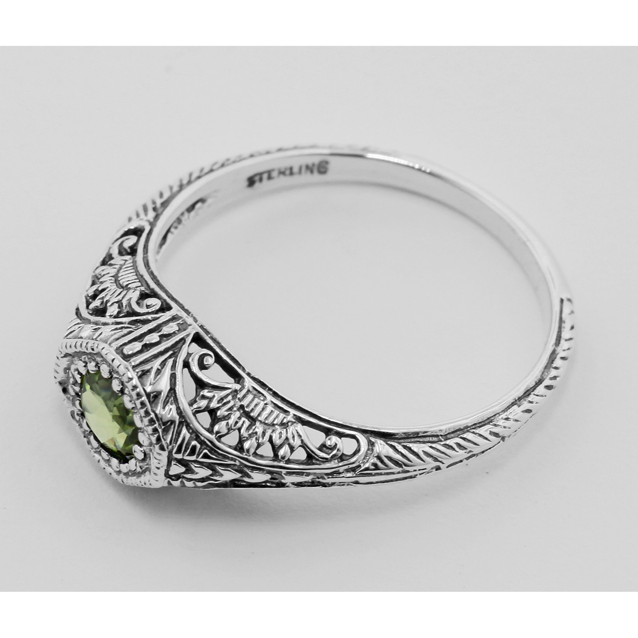 Detail view of Art Deco Style Peridot Solitaire Filigree Ring highlighting Peridot