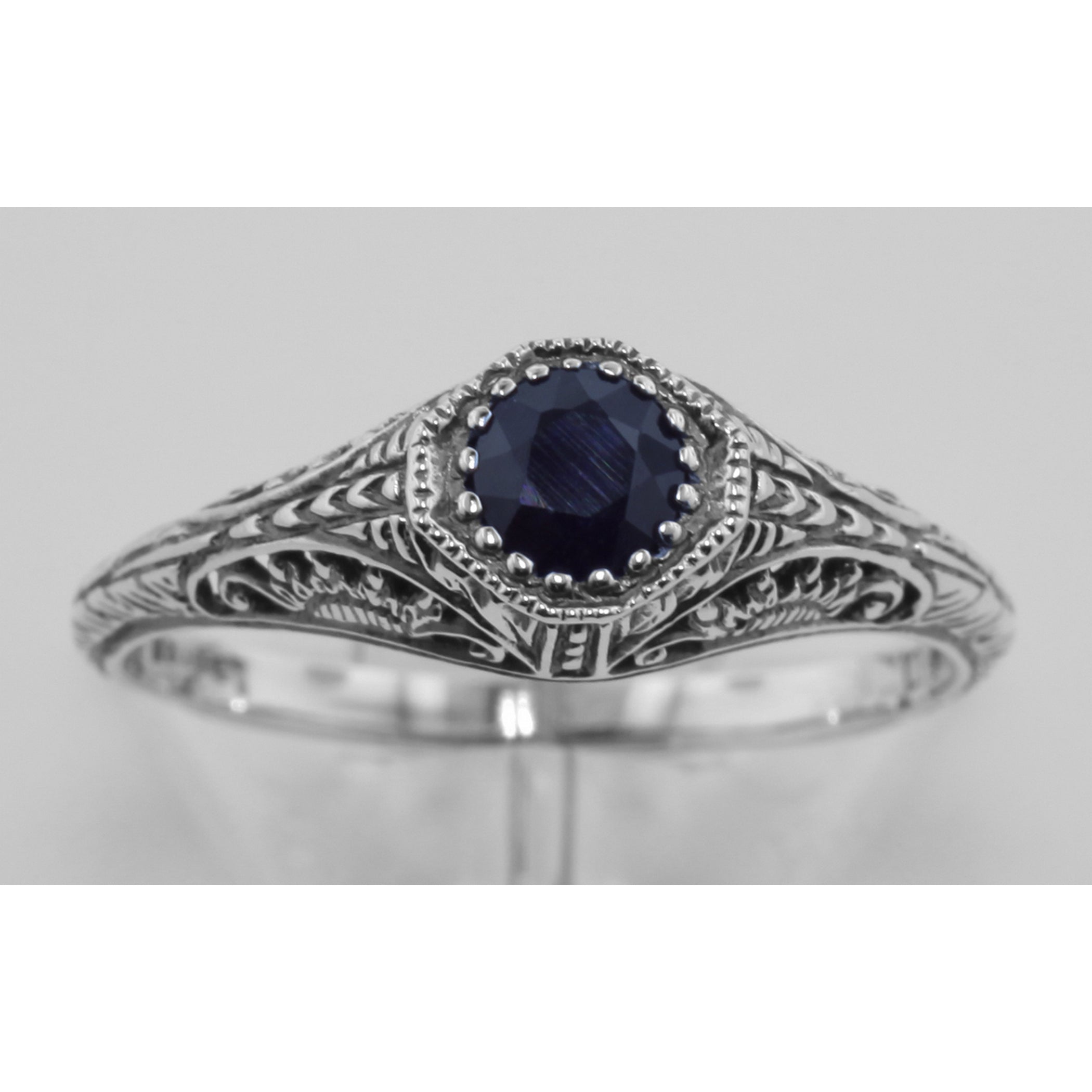 Detail view of Victorian Style Sapphire Filigree Ring Sterling Silver highlighting Sapphire