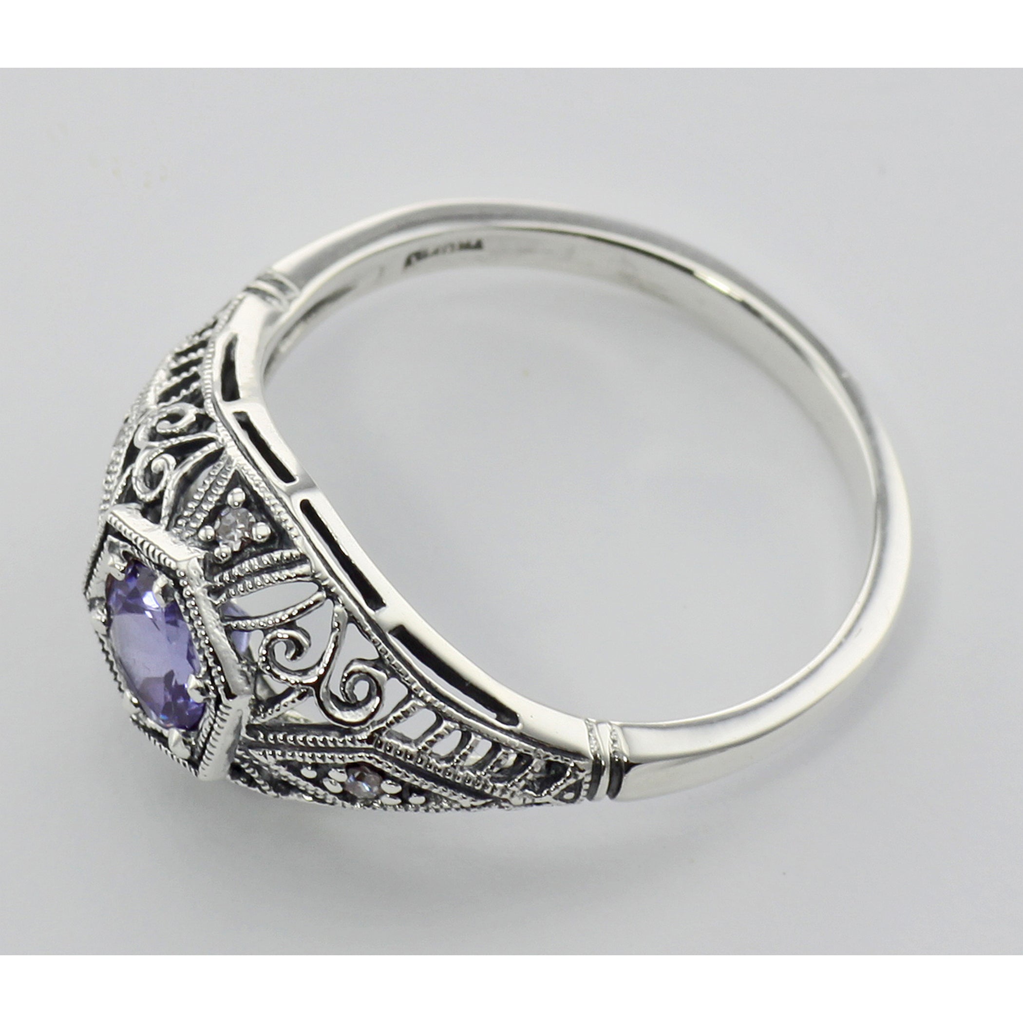 Detail view of Tanzanite Filigree Ring Art Deco Style w/ 4 Diamonds highlighting Diamond