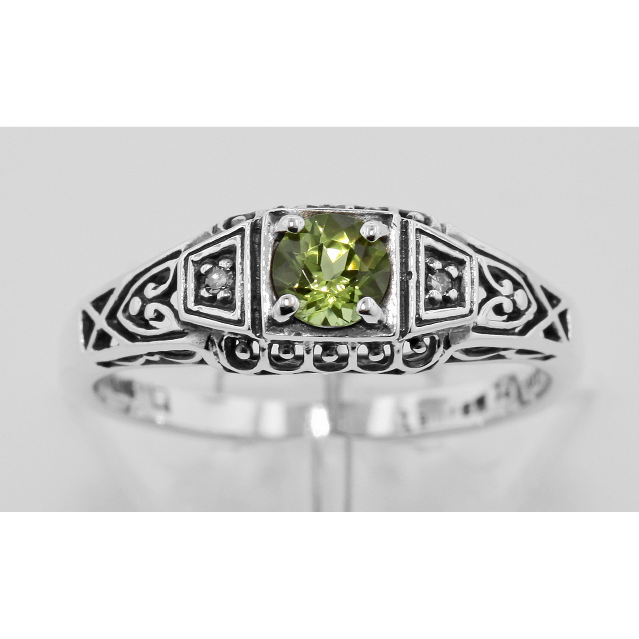 Detail view of Victorian Style Peridot and Diamond Filigree Ring highlighting Diamond, Peridot